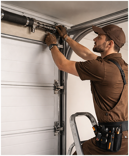 Complete Garage Door Service Technician repairing garage door system